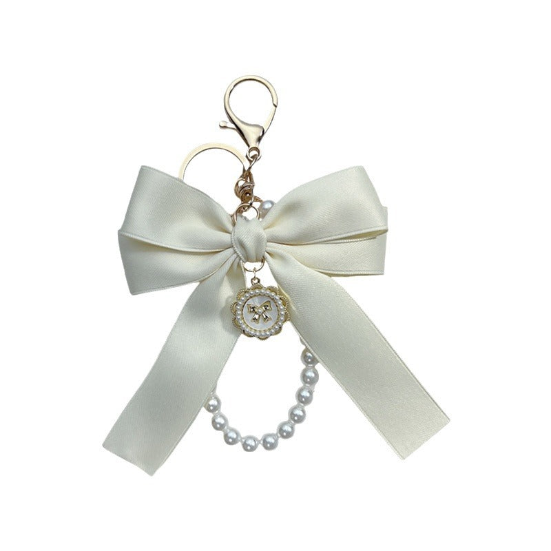 Bow Pearl Metal Wristlet