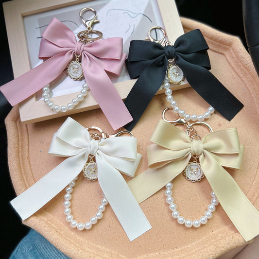 Bow Pearl Metal Wristlet