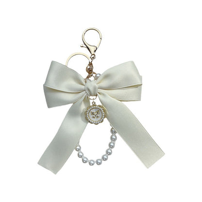 Bow Pearl Metal Wristlet