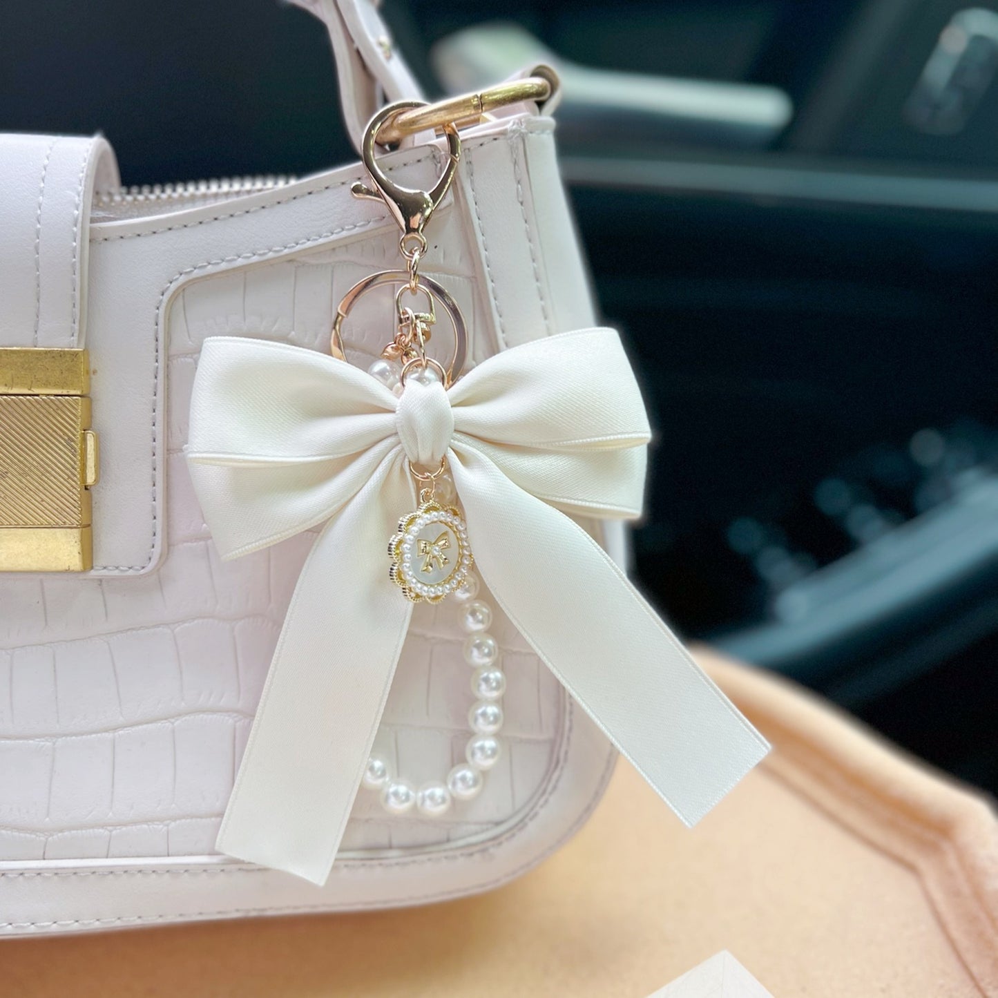 Bow Pearl Metal Wristlet