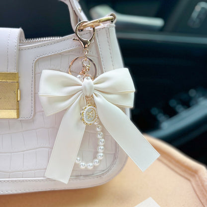 Bow Pearl Metal Wristlet