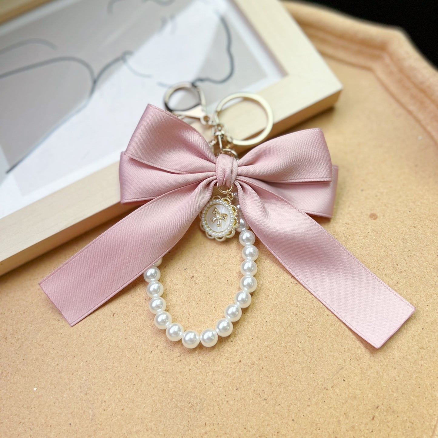Bow Pearl Metal Wristlet